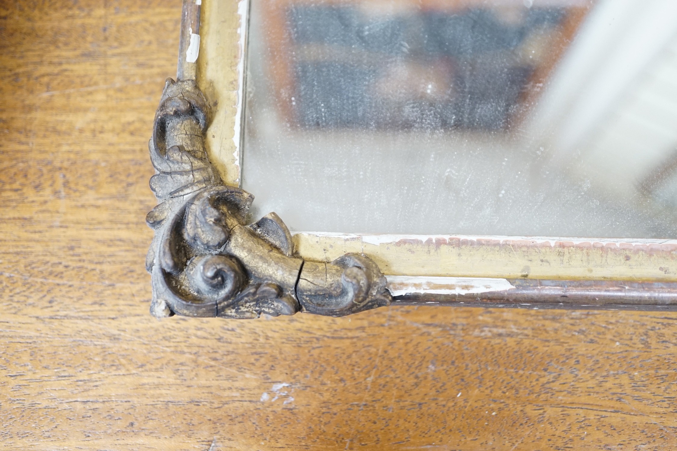 A gilt wooden mirror, 49cms wide, 40cm high